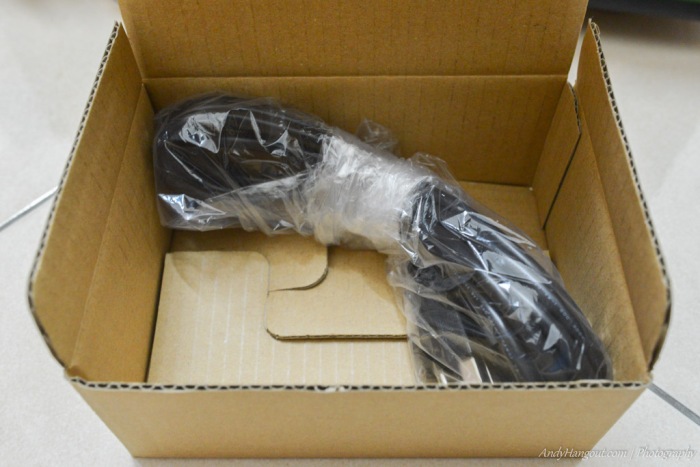 The stock power cord is neatly wrapped inside the box.